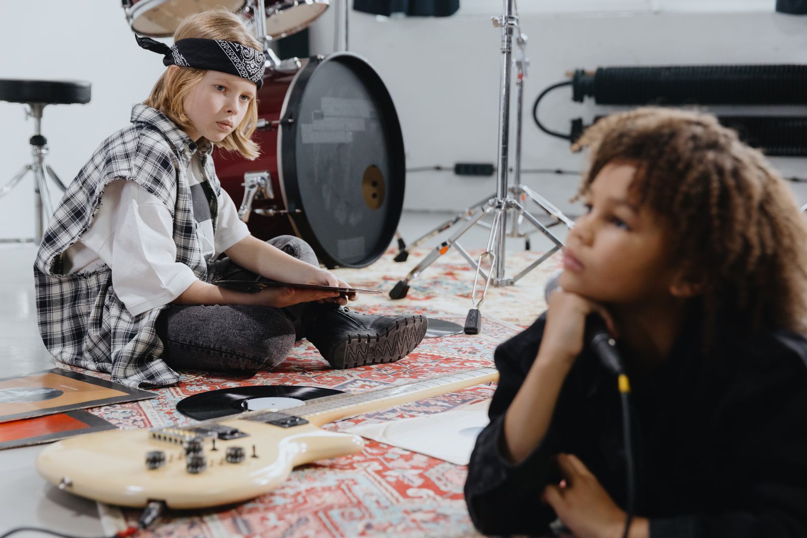 Kids creating music together in a songwriting workshop