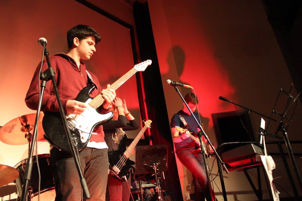Adults rehearsing together in the after-school House Band program