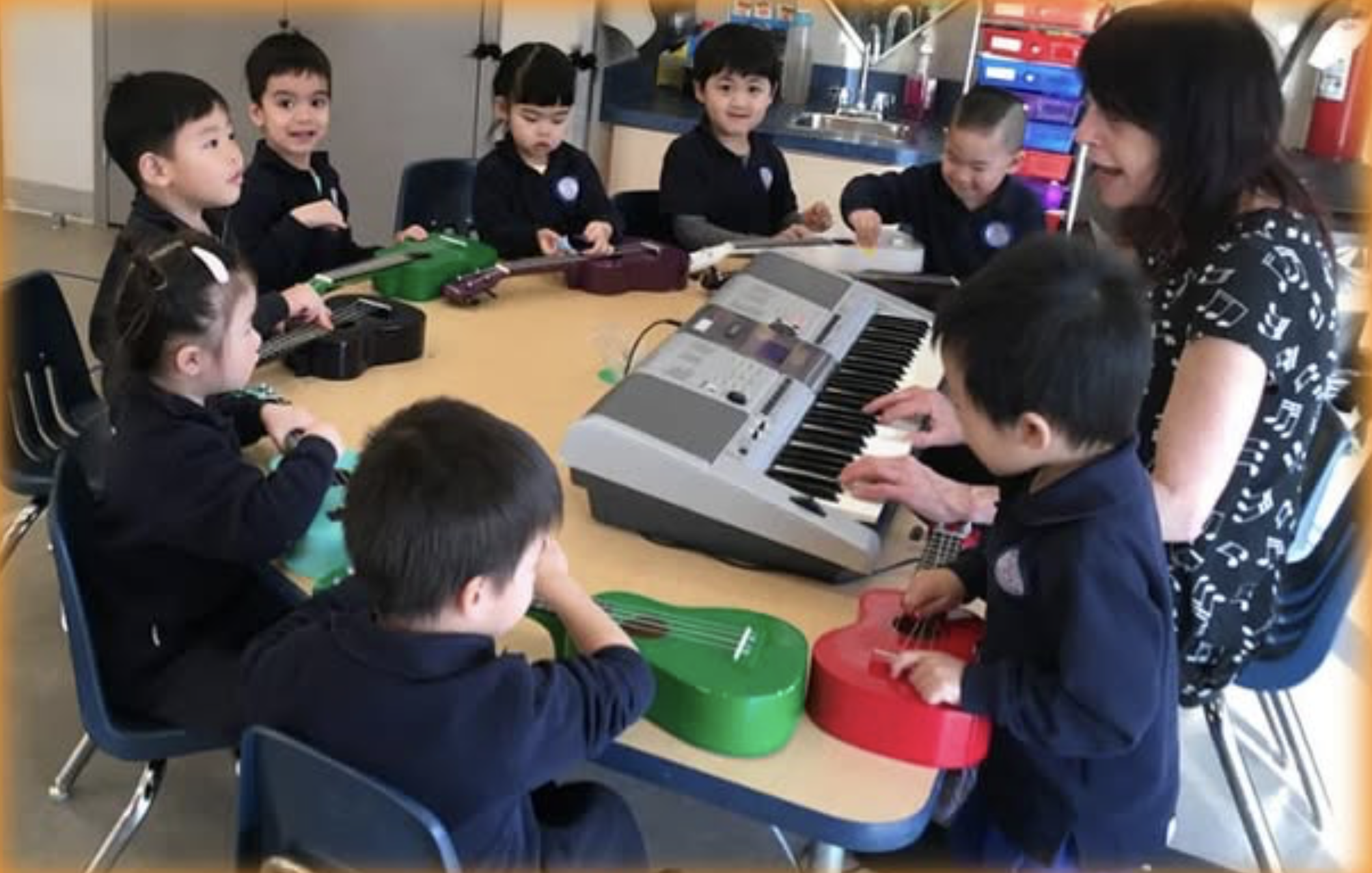 Young students gathered in a circle exploring instruments and rhythm — Junior Jammers