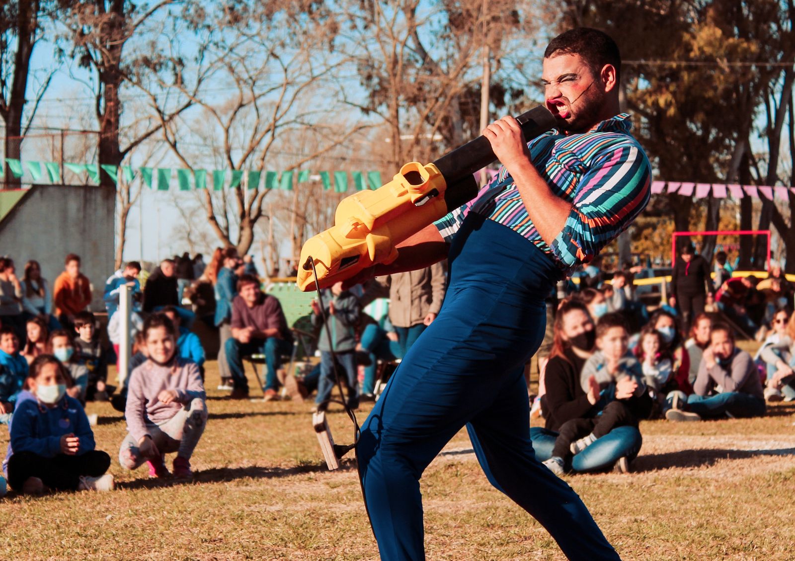 A performer engaging children at an interactive JUNKESTRA show
