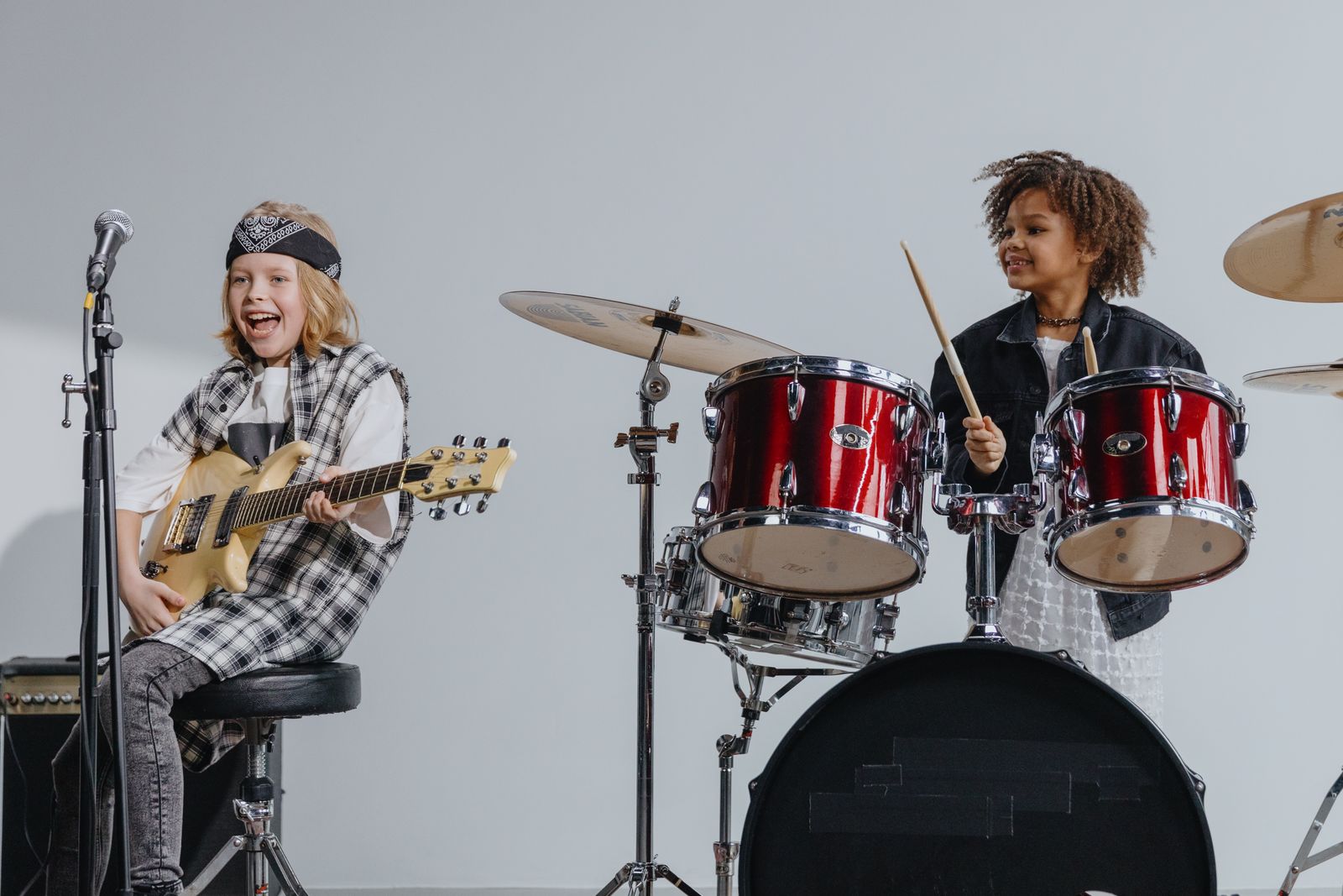 Teens rehearsing as a band at Rock Band Camp