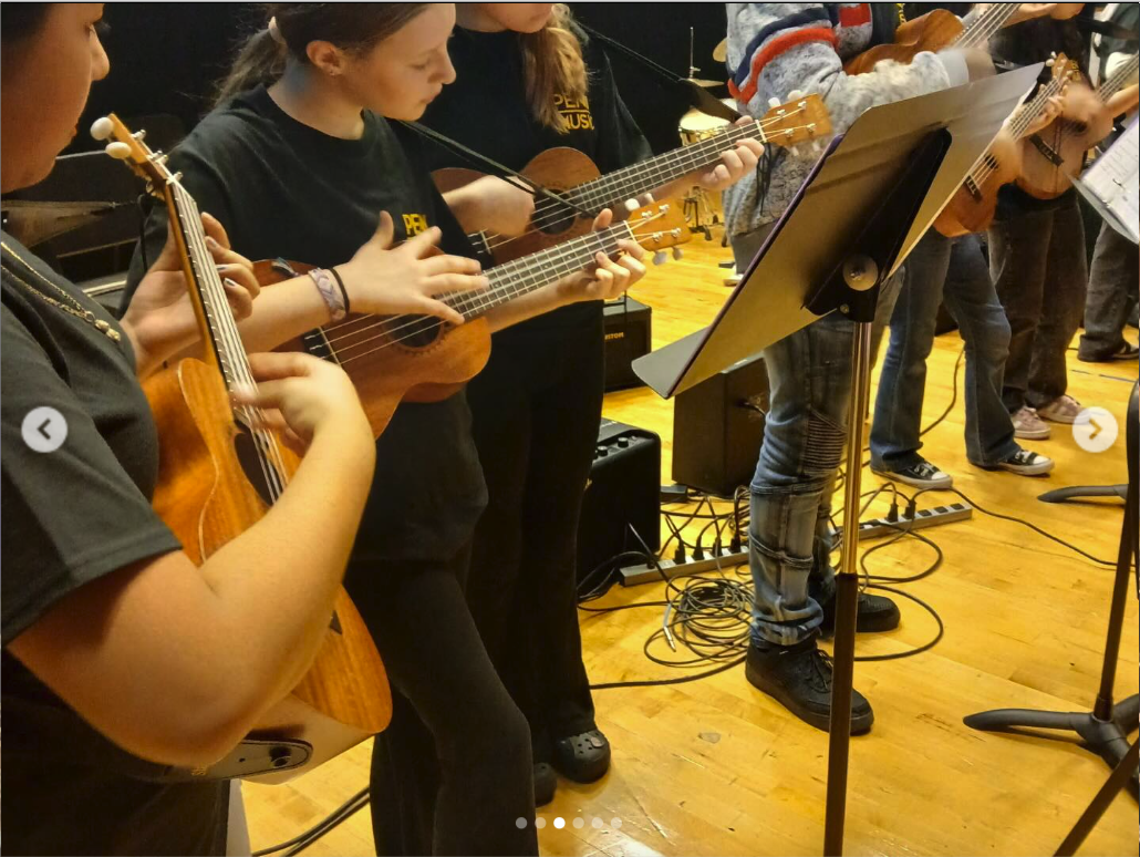 Elementary students playing ukulele together in an in-class ensemble — Ukulele Program